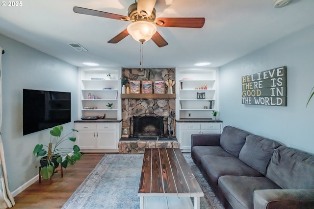 6132 Wilford Pl SW, Albany, OR 97321 - living area with dark wood-style floors, a ceiling fan, a fireplace, and built in features