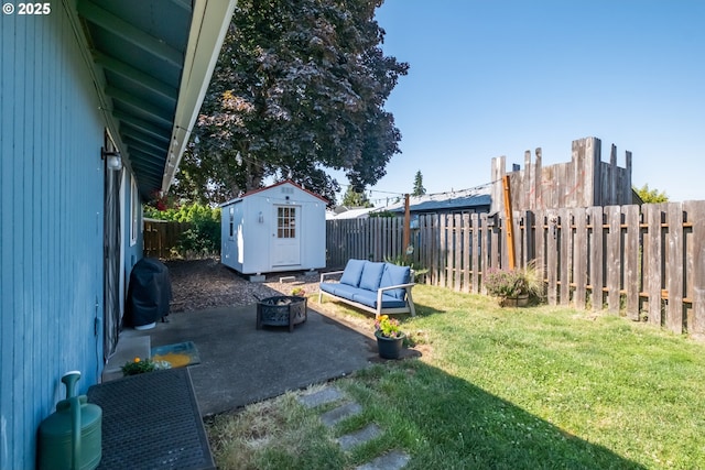 6132 Wilford Pl SW, Albany, OR 97321 - fenced backyard featuring a storage unit, an outdoor fire pit, and a patio