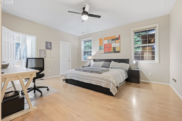 bedroom with ceiling fan and light hardwood / wood-style flooring