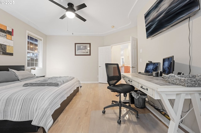 bedroom with ceiling fan and light hardwood / wood-style flooring