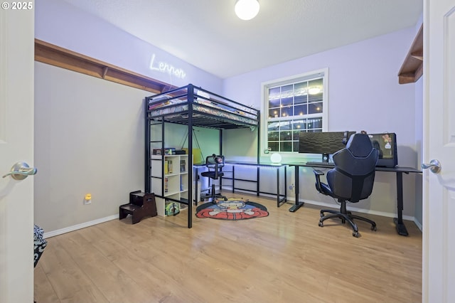 bedroom with light hardwood / wood-style flooring