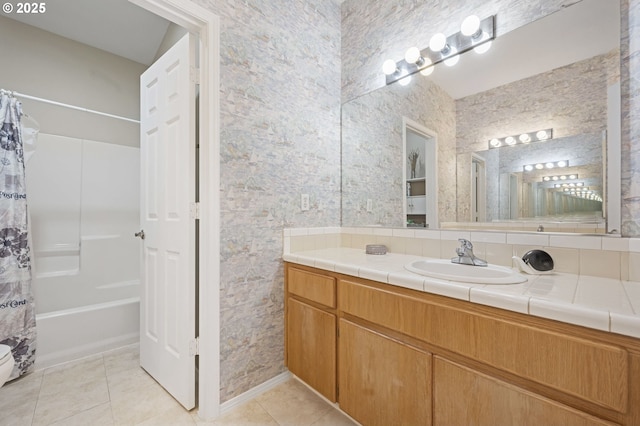 bathroom featuring tile patterned floors, shower / tub combo with curtain, and vanity