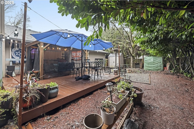 wooden terrace featuring a storage shed