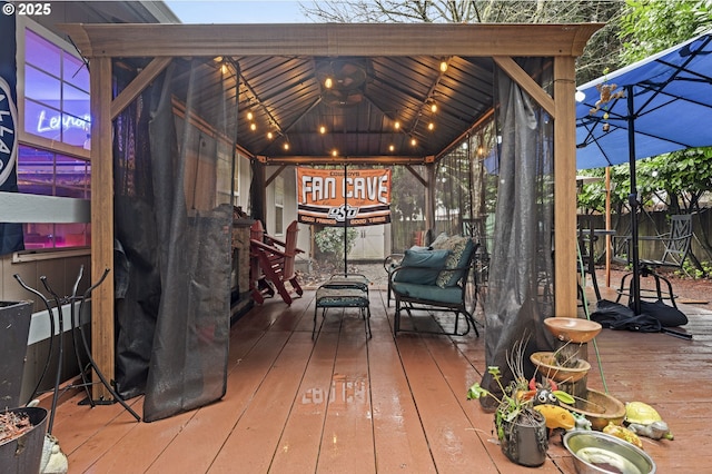 wooden terrace with a gazebo