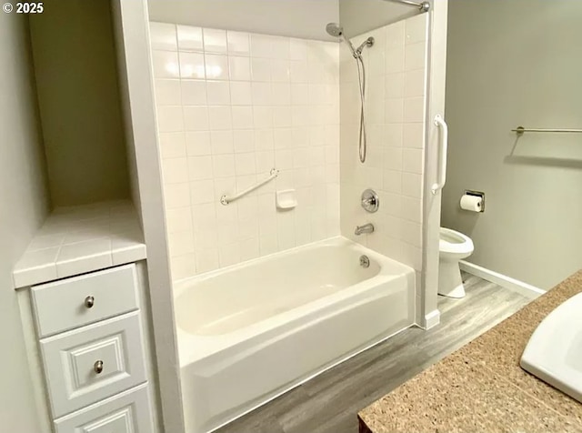 8416 SE Insley St, Portland, OR 97266 - full bath with toilet, wood finished floors, baseboards, and washtub / shower combination