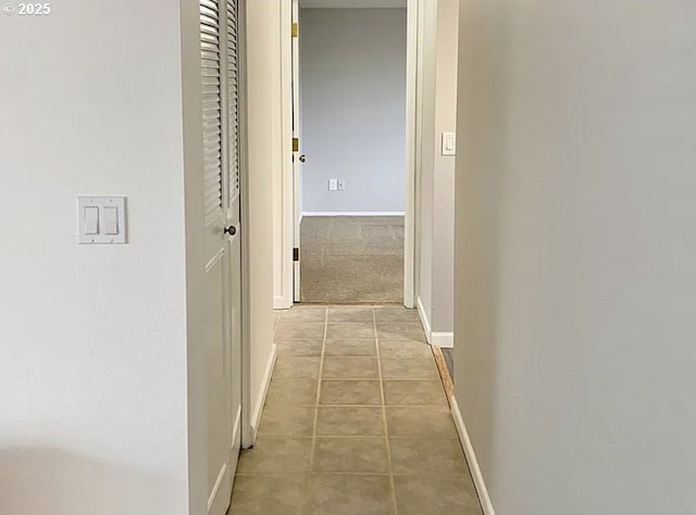 8416 SE Insley St, Portland, OR 97266 - hallway featuring light tile patterned flooring and baseboards