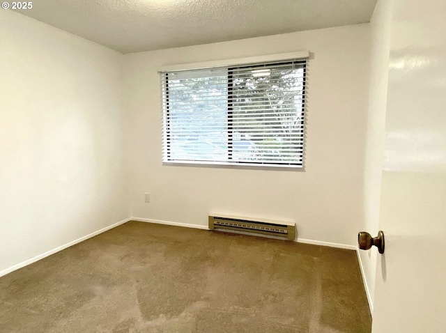 8416 SE Insley St, Portland, OR 97266 - empty room with carpet floors, baseboards, a textured ceiling, and baseboard heating