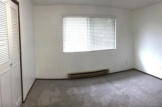 8416 SE Insley St, Portland, OR 97266 - unfurnished bedroom featuring carpet flooring, baseboard heating, a closet, and baseboards