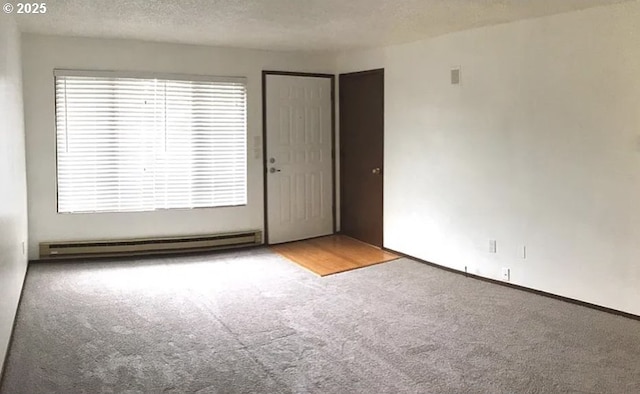 8416 SE Insley St, Portland, OR 97266 - unfurnished room with carpet flooring, a baseboard heating unit, and a textured ceiling