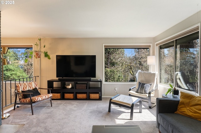 carpeted living room featuring a healthy amount of sunlight