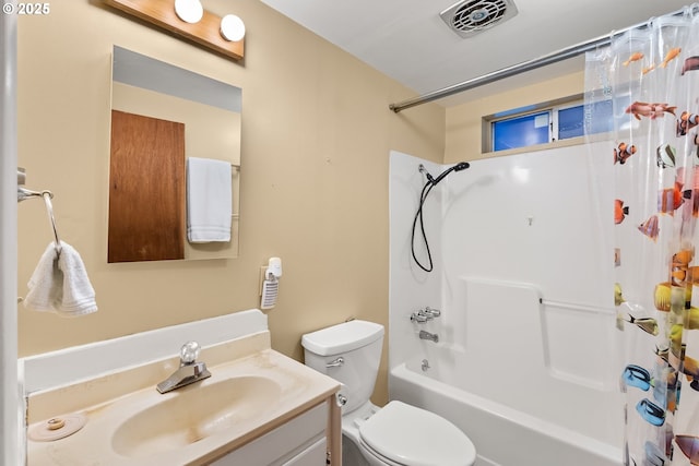 full bathroom with vanity, shower / bath combination with curtain, and toilet