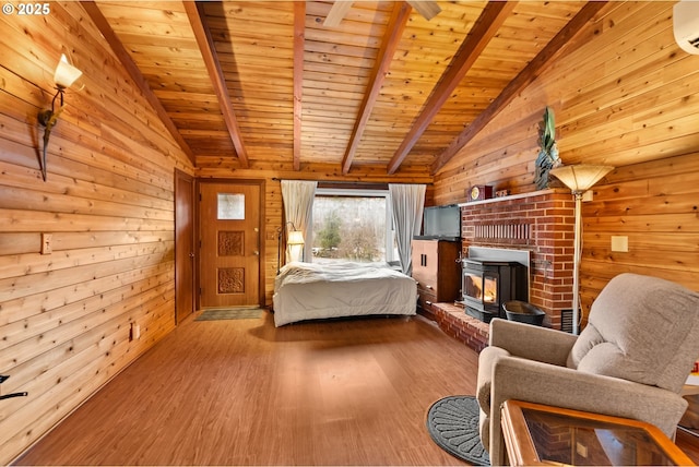 unfurnished bedroom featuring vaulted ceiling with beams, hardwood / wood-style floors, wooden ceiling, and wooden walls