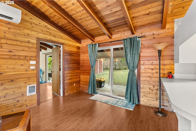 interior space featuring lofted ceiling with beams, wooden ceiling, a wall mounted AC, and wood walls