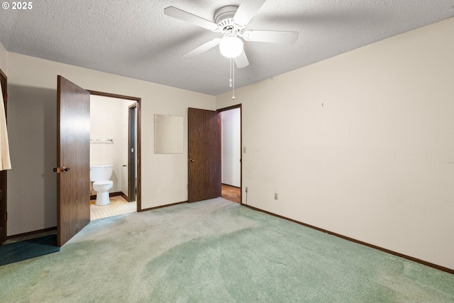 16739 NE Glisan St, Gresham, OR 97230 - unfurnished bedroom with carpet flooring, a textured ceiling, ensuite bath, and ceiling fan