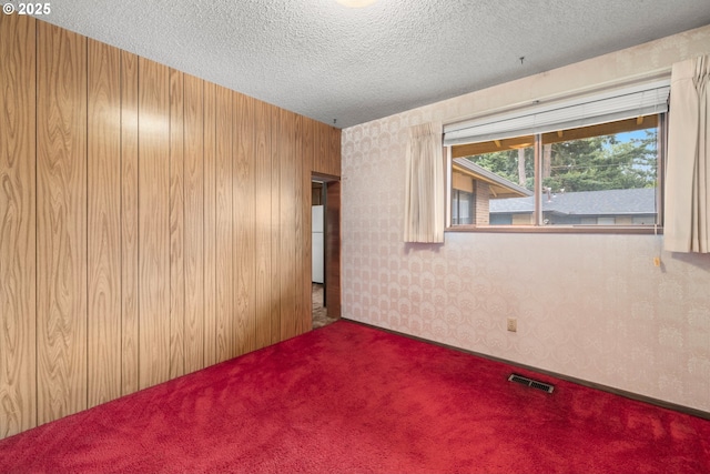 16739 NE Glisan St, Gresham, OR 97230 - empty room featuring carpet flooring and a textured ceiling