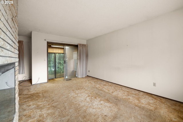 16739 NE Glisan St, Gresham, OR 97230 - unfurnished room with a fireplace and carpet flooring
