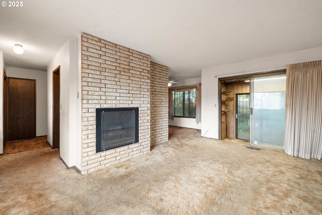 16739 NE Glisan St, Gresham, OR 97230 - unfurnished living room with a textured ceiling, a brick fireplace, and carpet