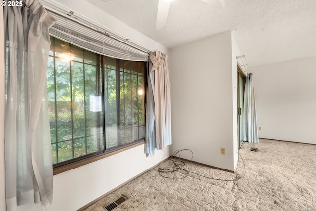 16739 NE Glisan St, Gresham, OR 97230 - spare room with carpet floors, a ceiling fan, and a textured ceiling