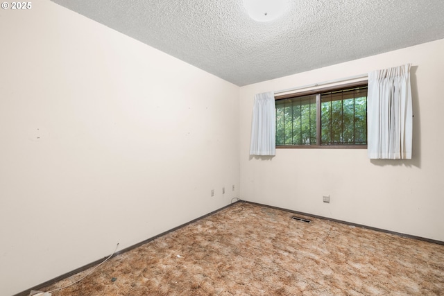 16739 NE Glisan St, Gresham, OR 97230 - empty room with a textured ceiling and carpet floors