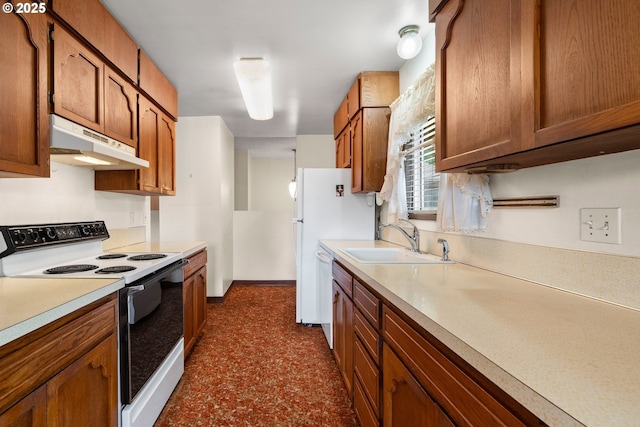 16739 NE Glisan St, Gresham, OR 97230 - kitchen featuring white appliances, under cabinet range hood, light countertops, and brown cabinetry