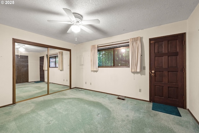 16739 NE Glisan St, Gresham, OR 97230 - unfurnished bedroom with carpet floors, a textured ceiling, a ceiling fan, and a closet