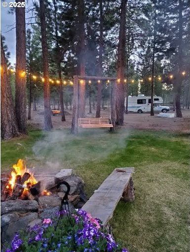 view of home's community with a fire pit