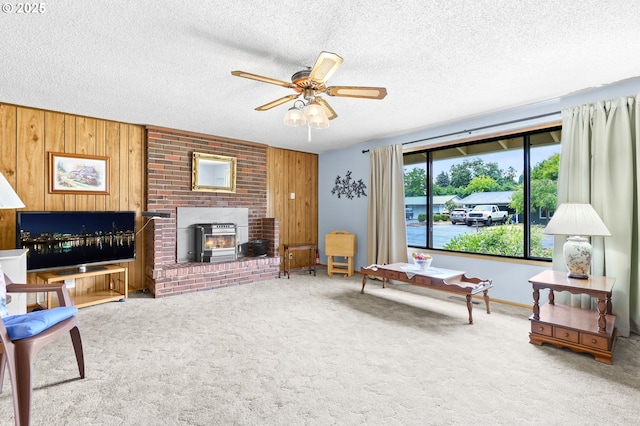 1120 N Lupine Ct, Canby, OR 97013 - living room with ceiling fan, carpet flooring, wood walls, and a textured ceiling