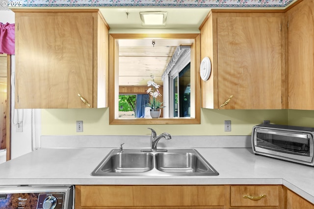 1120 N Lupine Ct, Canby, OR 97013 - kitchen with dishwasher, light countertops, and brown cabinets
