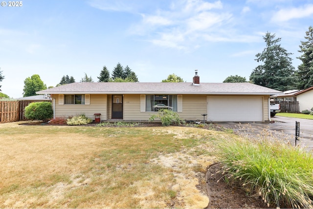 1120 N Lupine Ct, Canby, OR 97013 - ranch-style house featuring concrete driveway, a garage, and a chimney