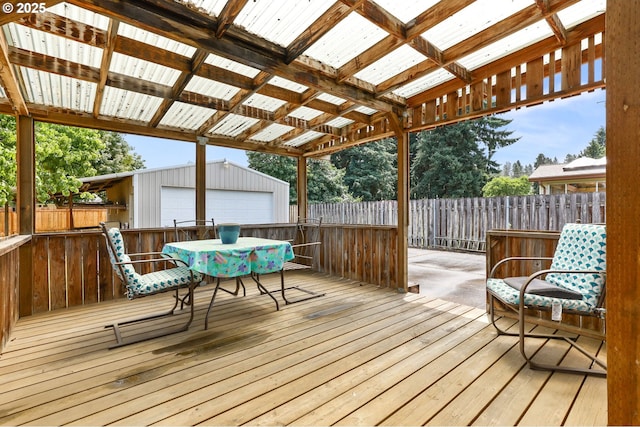 1120 N Lupine Ct, Canby, OR 97013 - deck with an outbuilding, outdoor dining space, and a garage