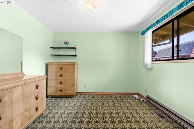 1120 N Lupine Ct, Canby, OR 97013 - unfurnished bedroom with a textured ceiling and tile patterned floors