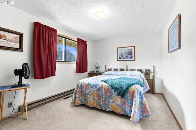 1120 N Lupine Ct, Canby, OR 97013 - carpeted bedroom with a baseboard heating unit and a textured ceiling