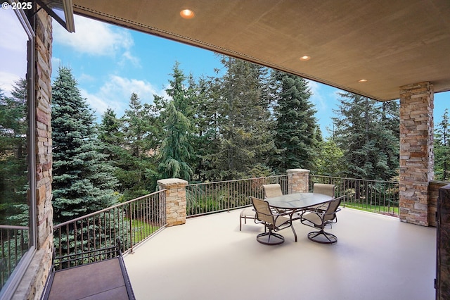 view of patio featuring a balcony
