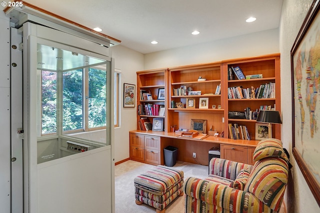 sitting room with baseboards, recessed lighting, and light colored carpet