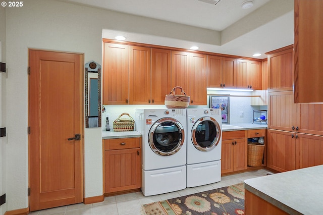 laundry area featuring recessed lighting, cabinet space, light tile patterned floors, and washing machine and clothes dryer