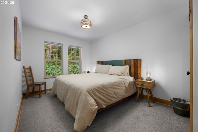 bedroom with carpet floors and baseboards