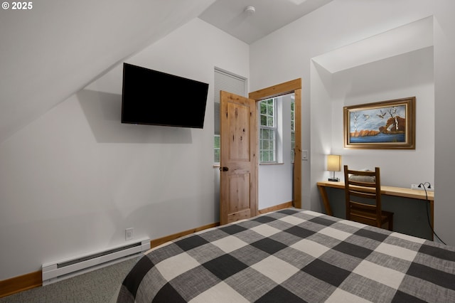 bedroom with a baseboard radiator, lofted ceiling, and baseboards