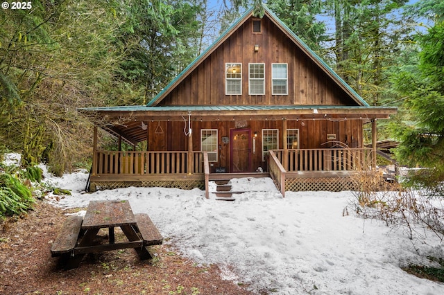 view of front of home with covered porch and metal roof