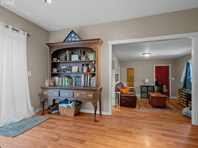 sitting room with light wood-style floors and baseboards