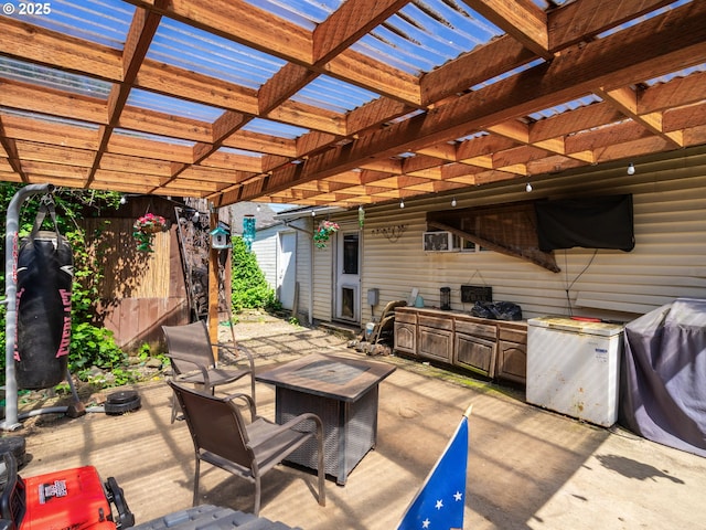 view of patio with a pergola and an outdoor kitchen
