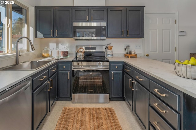 kitchen featuring appliances with stainless steel finishes and a sink