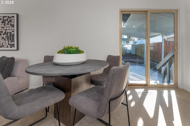 dining space with baseboards and breakfast area