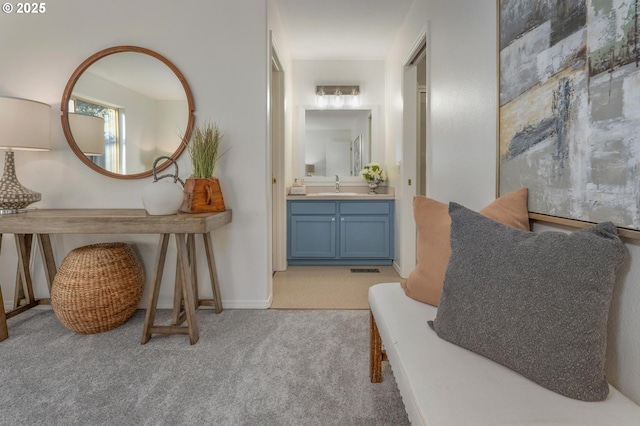 bathroom with a sink and baseboards