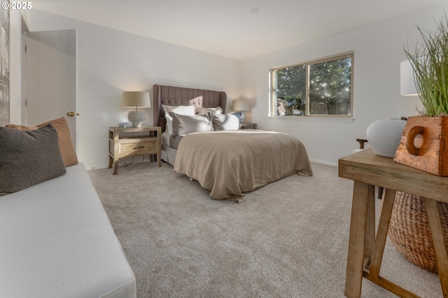 bedroom with carpet floors and baseboards