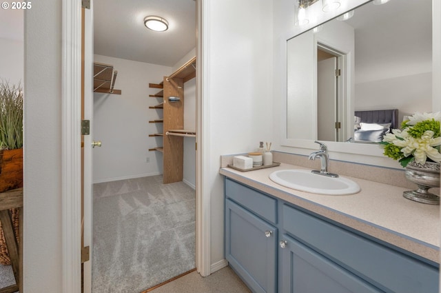 bathroom with vanity and baseboards