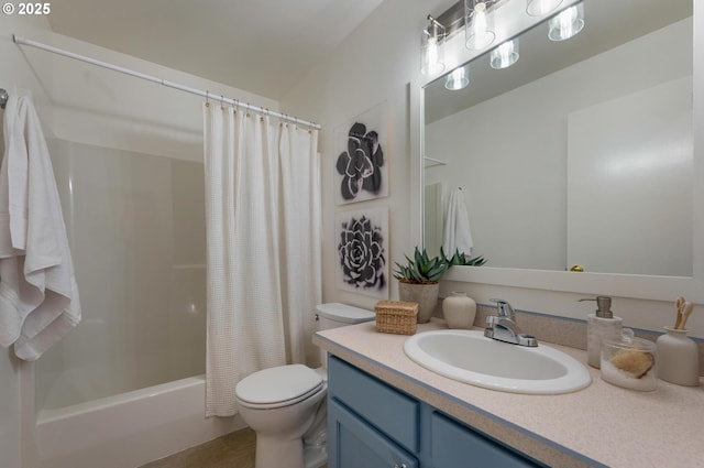 bathroom with shower / bath combo with shower curtain, vanity, and toilet