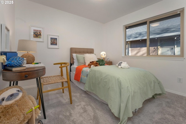 bedroom with baseboards and carpet flooring