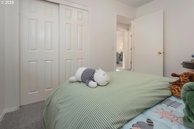 carpeted bedroom with a closet