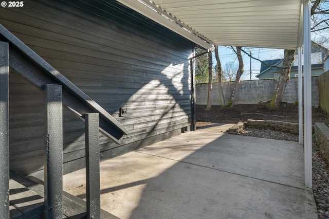 view of patio / terrace featuring fence