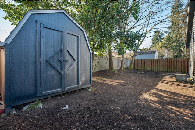 view of shed featuring a fenced backyard